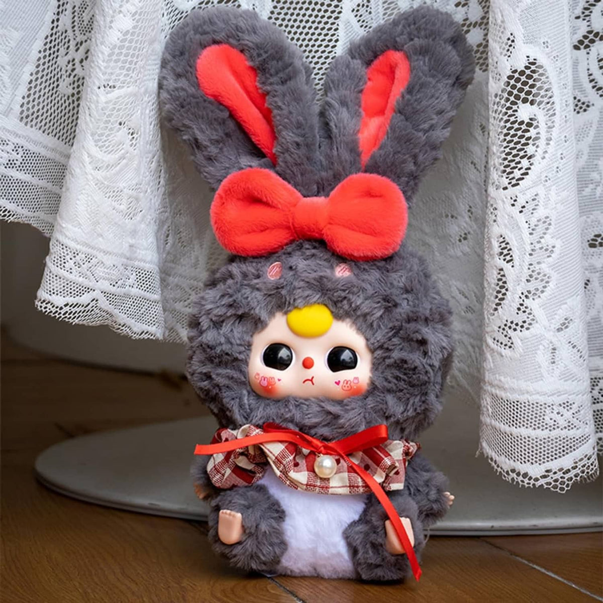 Gray rabbit plush blind box figure with red bow tie and small carrot-themed details