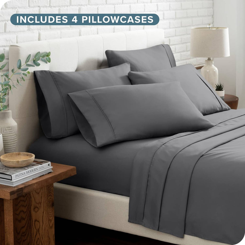 Grey queen bed linen set with 4 pillowcases and fitted sheet, styled on a bed