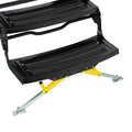 Black RV step stabilizer kit with yellow support legs and metal mounting brackets