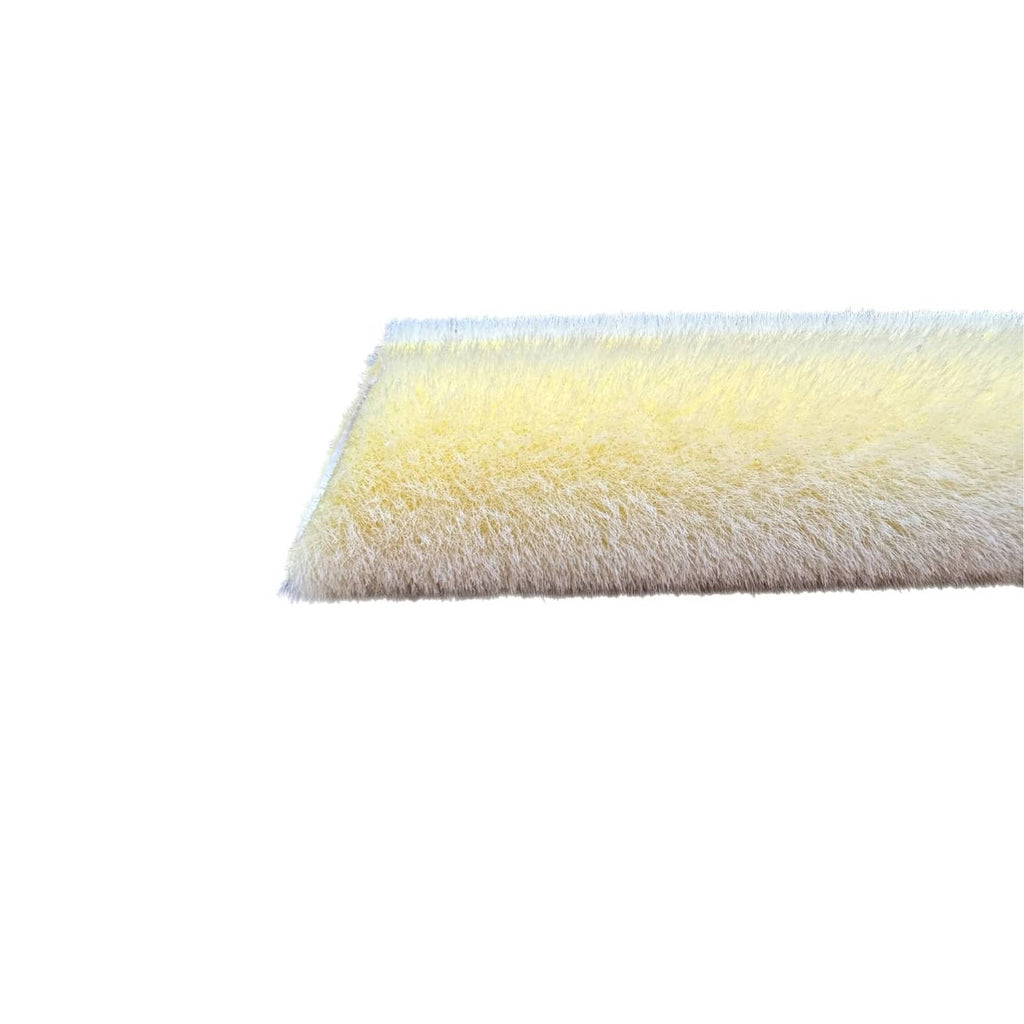 Close-up of yellow roller cover edge with dense fuzzy nap