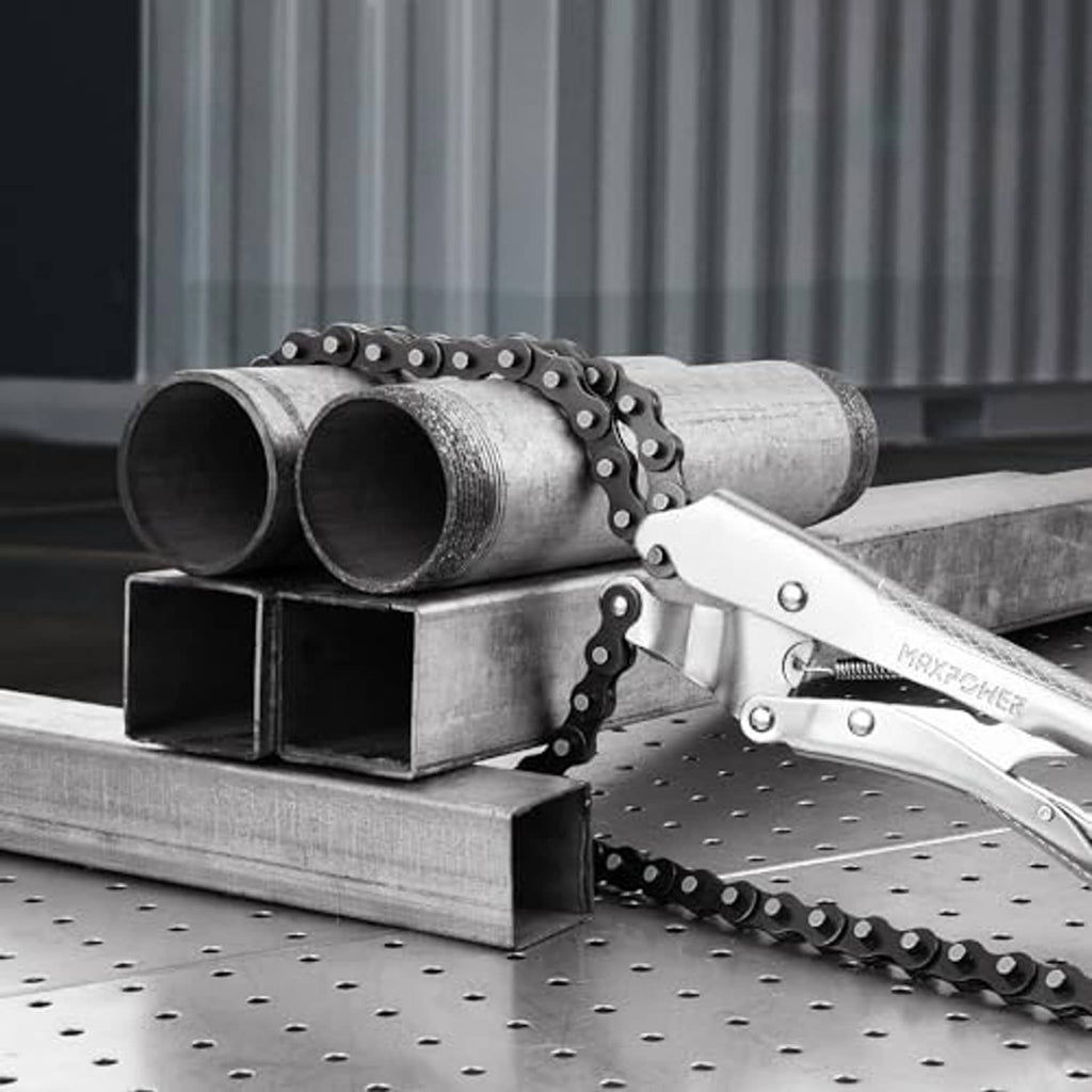Chain clamp pliers securing metal pipes on a perforated workbench with black chain