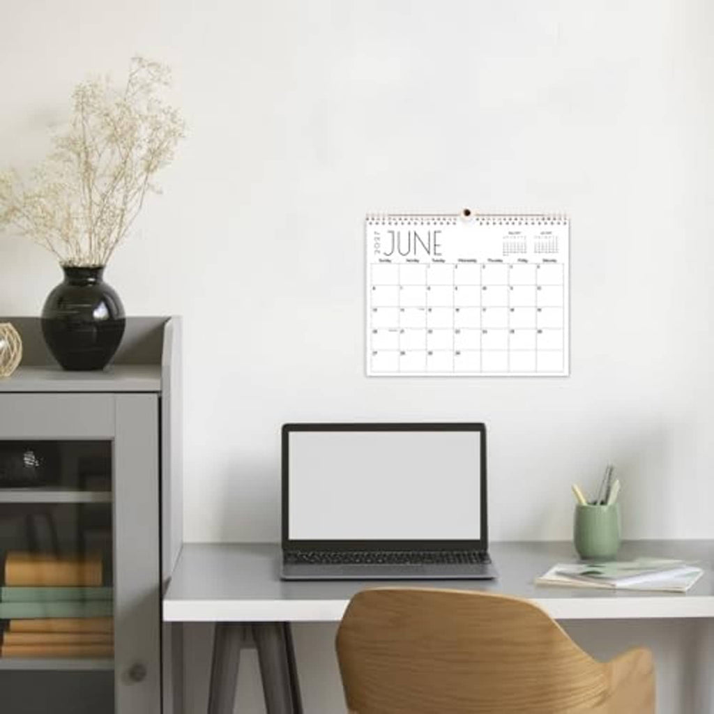 Wall calendar with spiral binding, June monthly grid with black month title