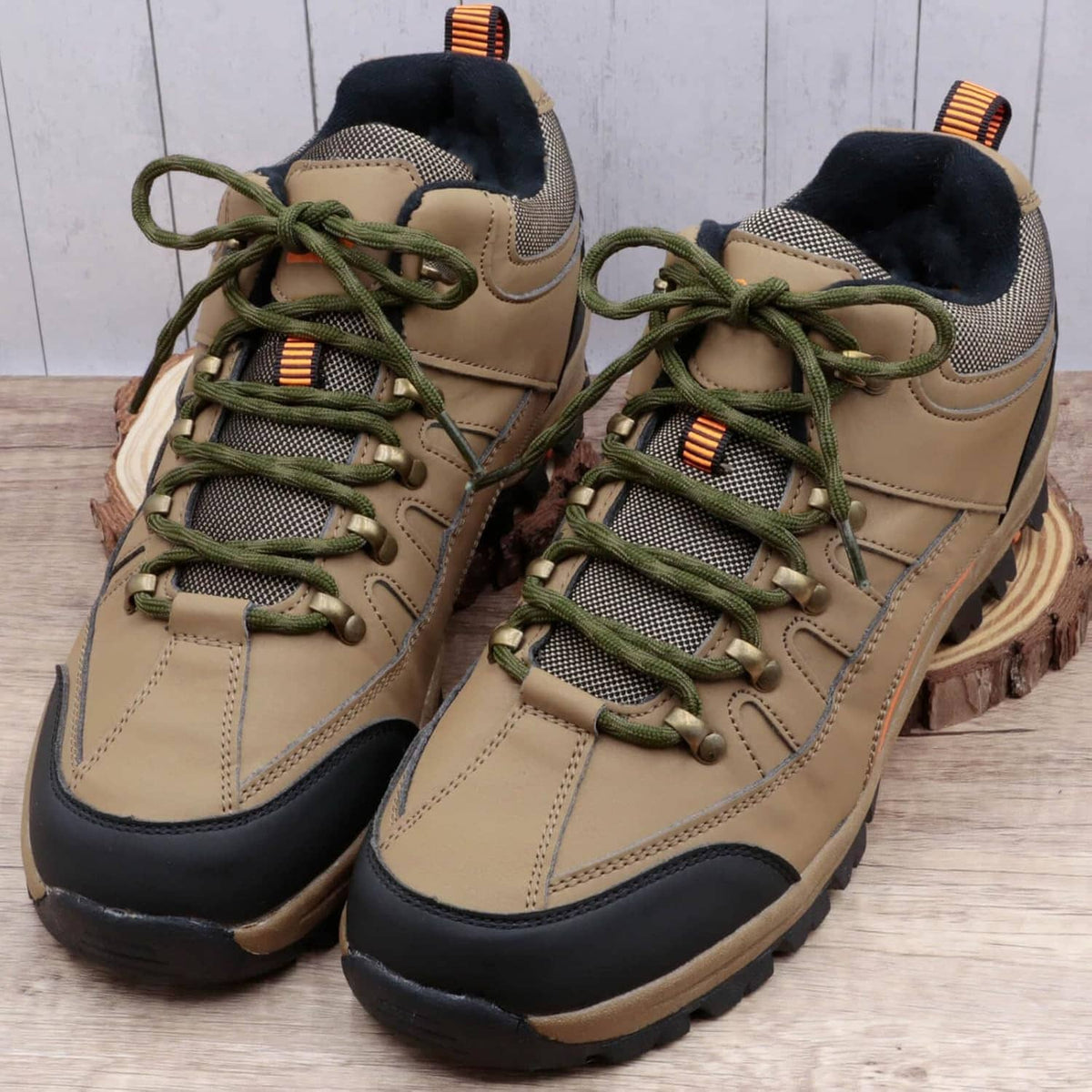Tan hiking shoes with green round wave shoelaces, braided texture laced through eyelets