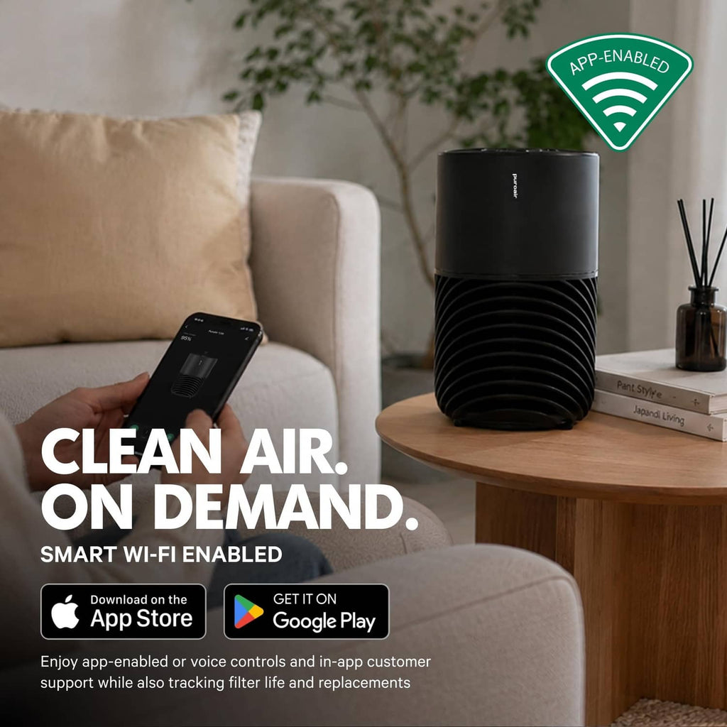 Black PuroAir 130i air purifier with app control, smartphone nearby