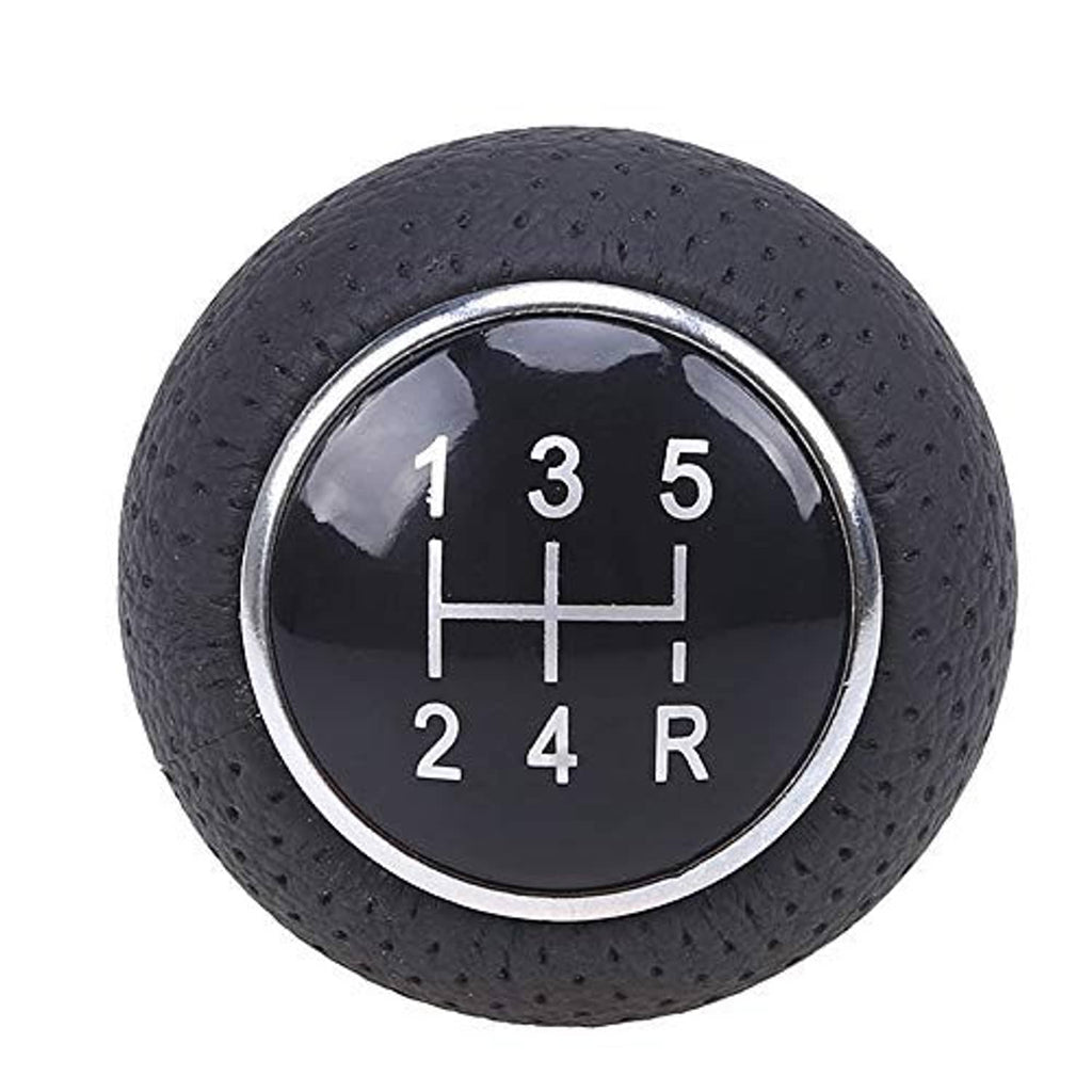 Close-up of 5-speed gear shift knob top with black dial showing numbers 1–5 and R