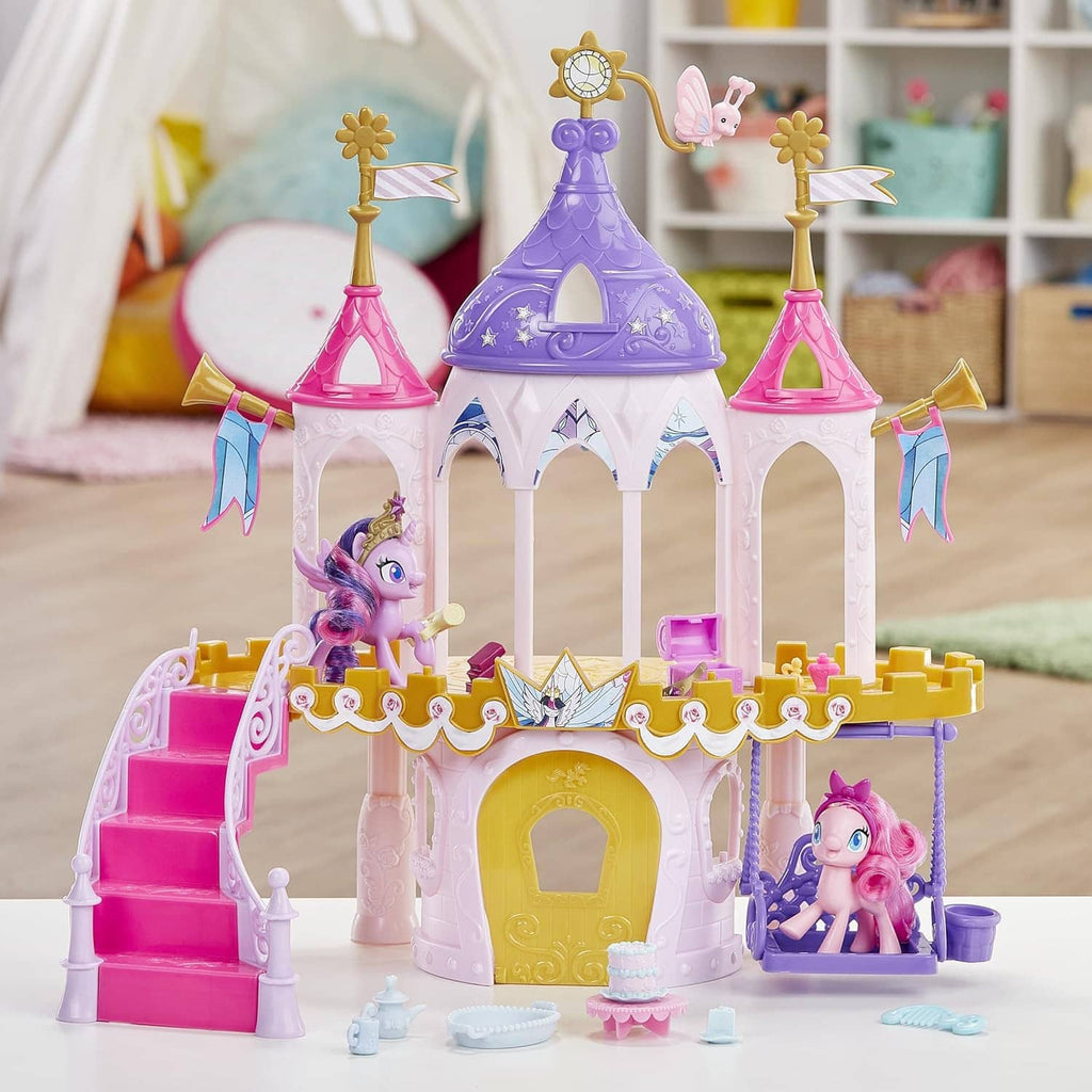 Purple and pink pony castle playset with golden door, side steps, and pony figures