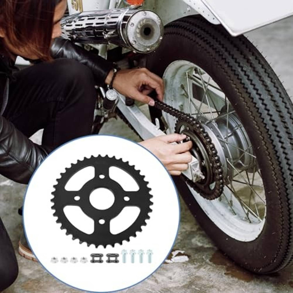 Mini bike sprocket kit with black gear and mounting hardware next to assembled wheel