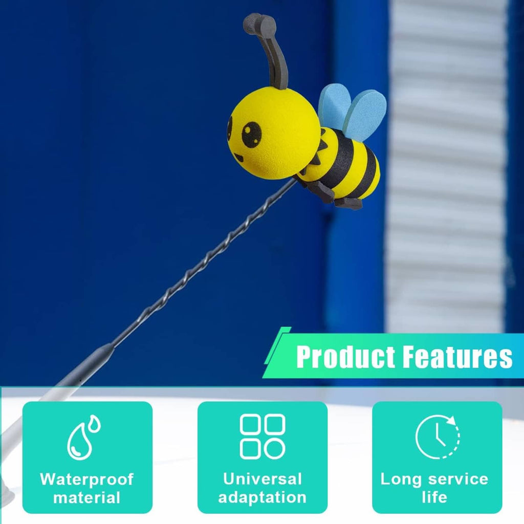 Yellow foam bee antenna topper with black stripes and blue wings on a dark antenna