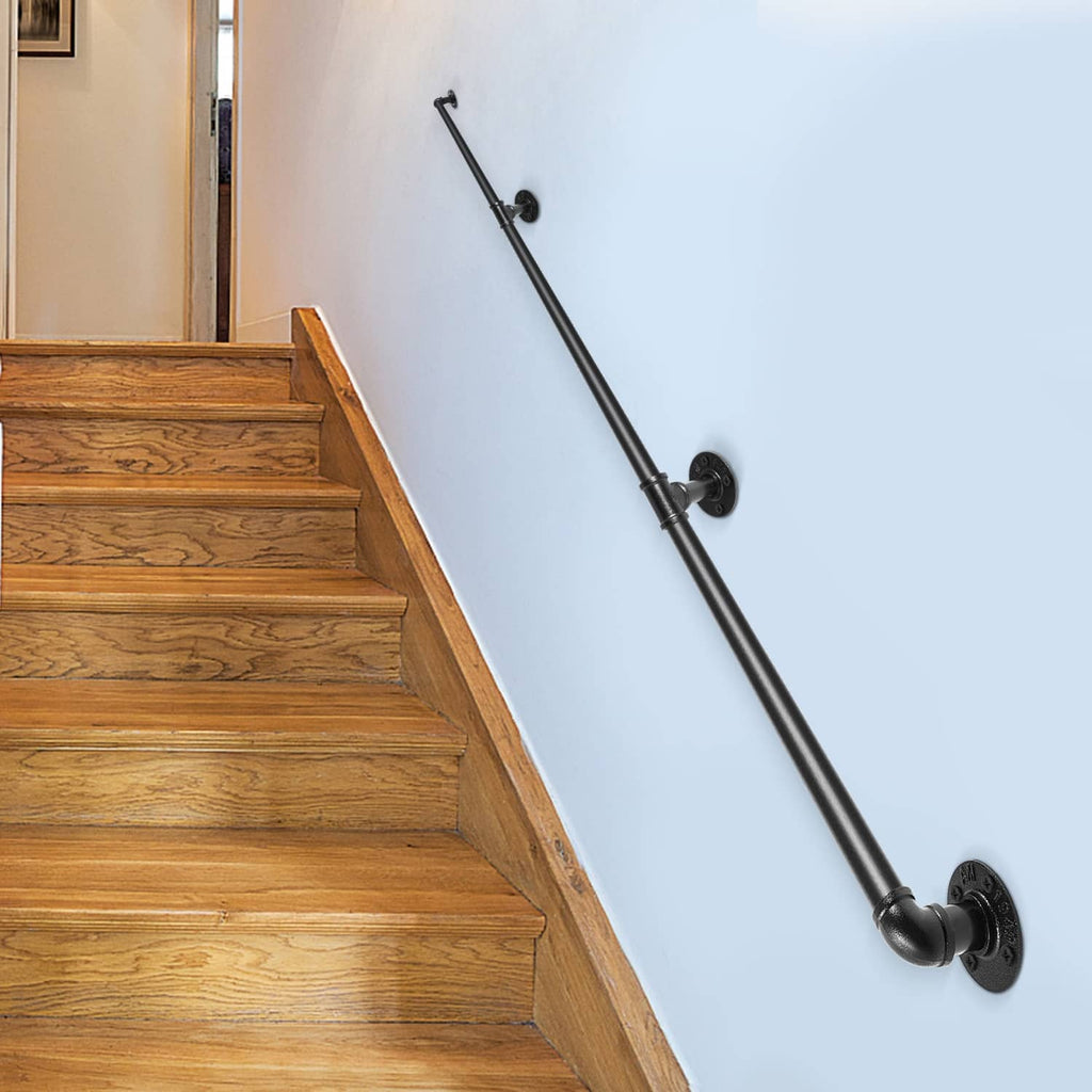 Wall-mounted matte black stair handrail along wooden steps with round mounting brackets