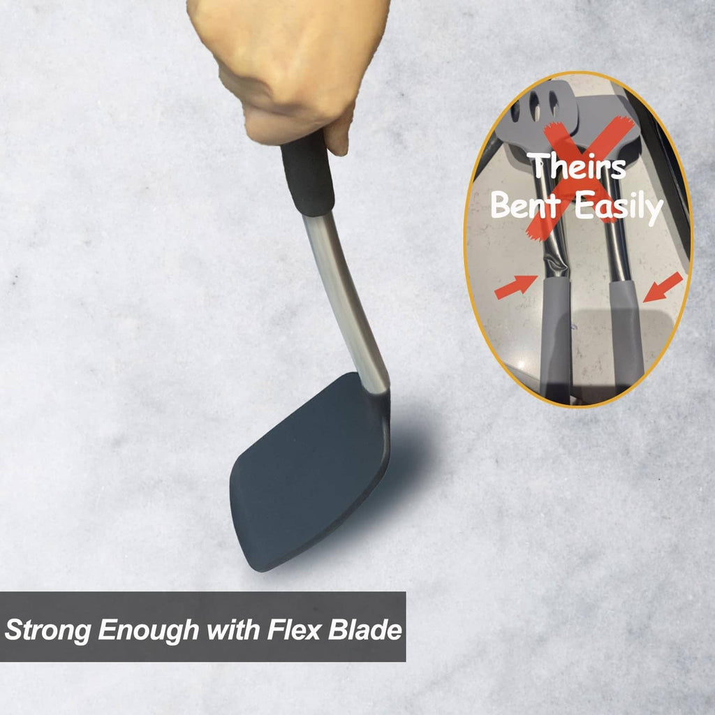 Black silicone spatula with flexible blade shown under hand pressure