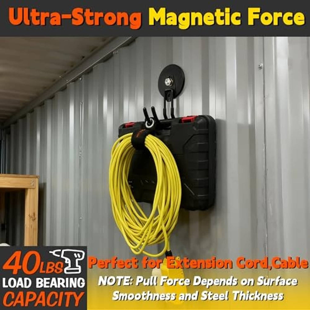 Black magnetic hooks on a wall surface, holding a coil of yellow extension cord