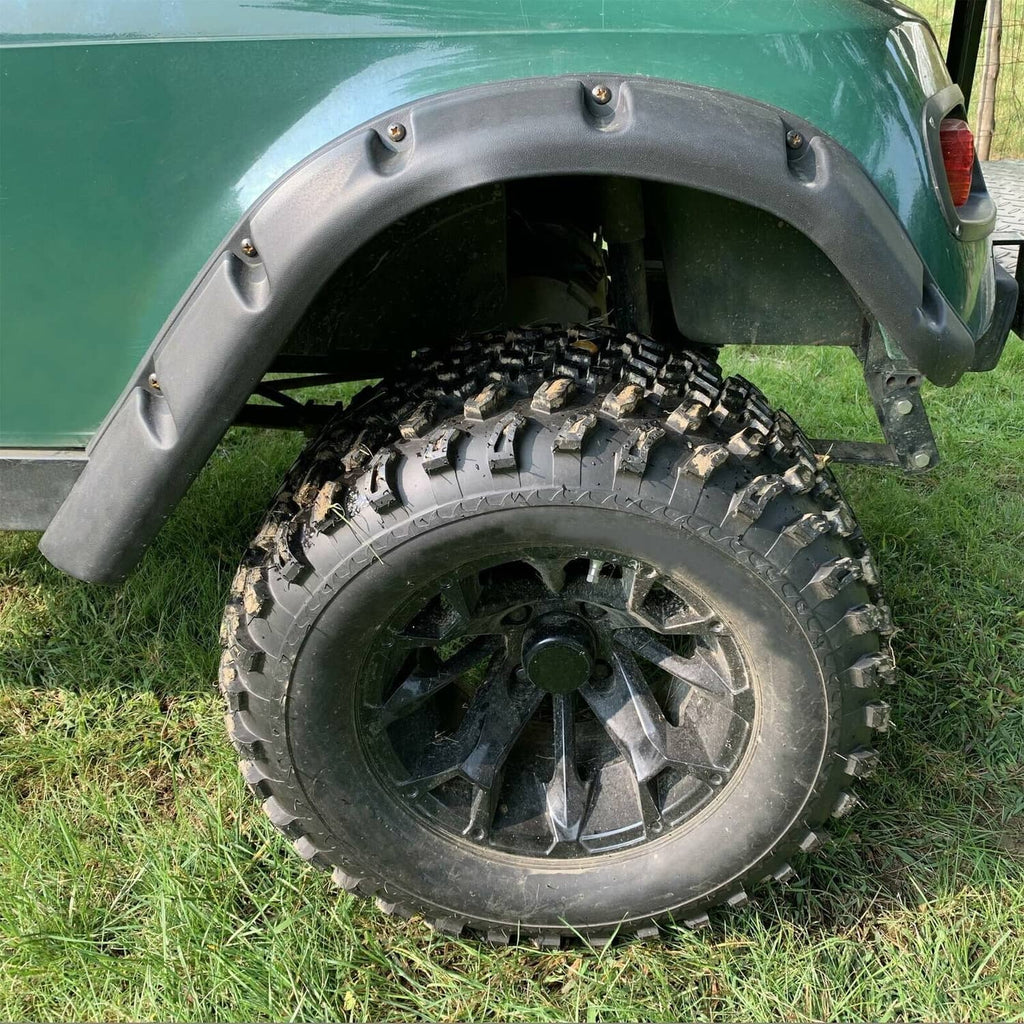 Close-up of black fender flare over a golf cart rear wheel