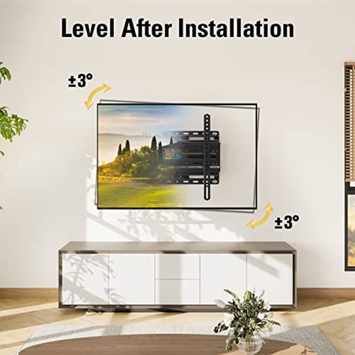Black TV wall mount installed on wall with level adjustment range