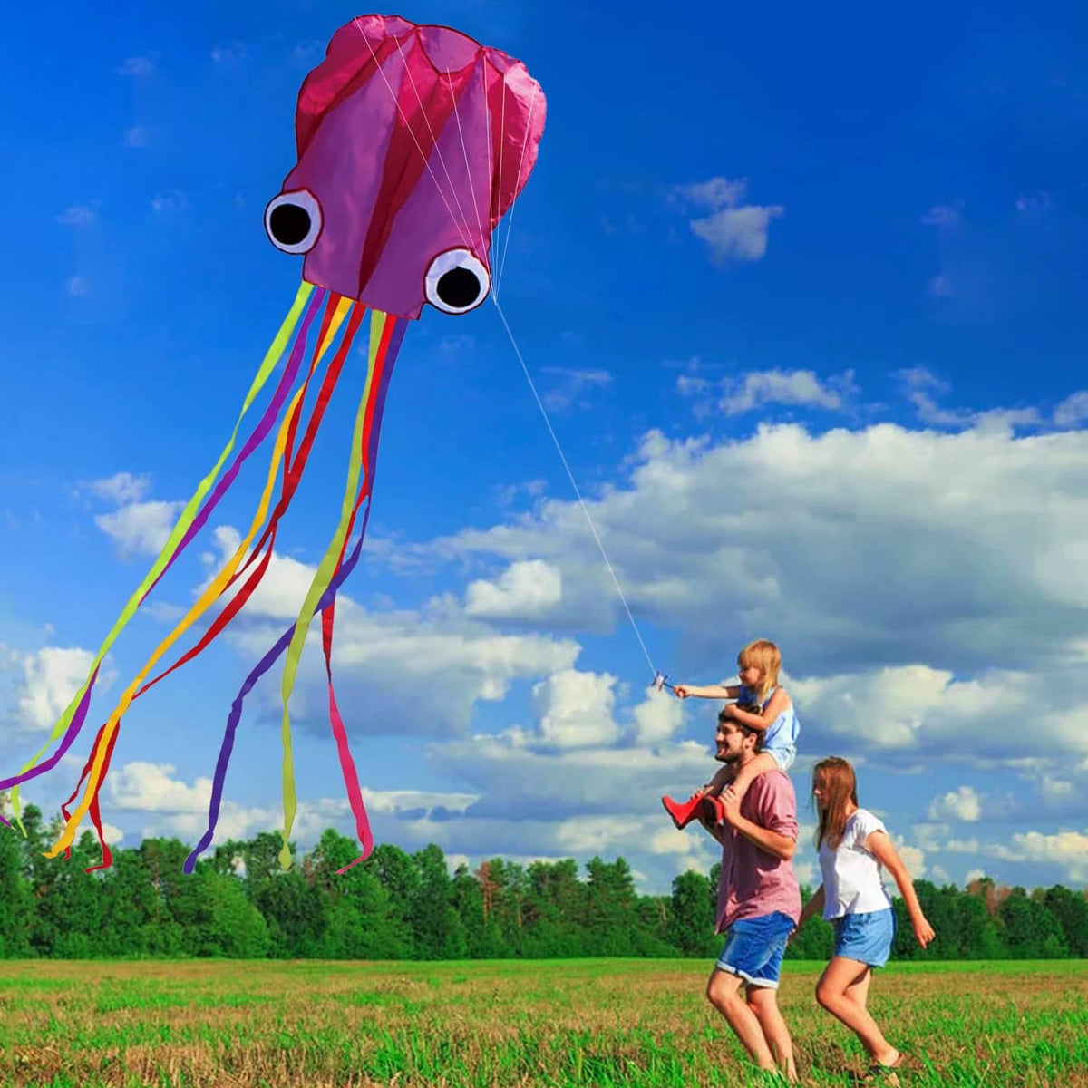Octopus kite with pink-purple sail-like body and flowing red, green, yellow ribbons
