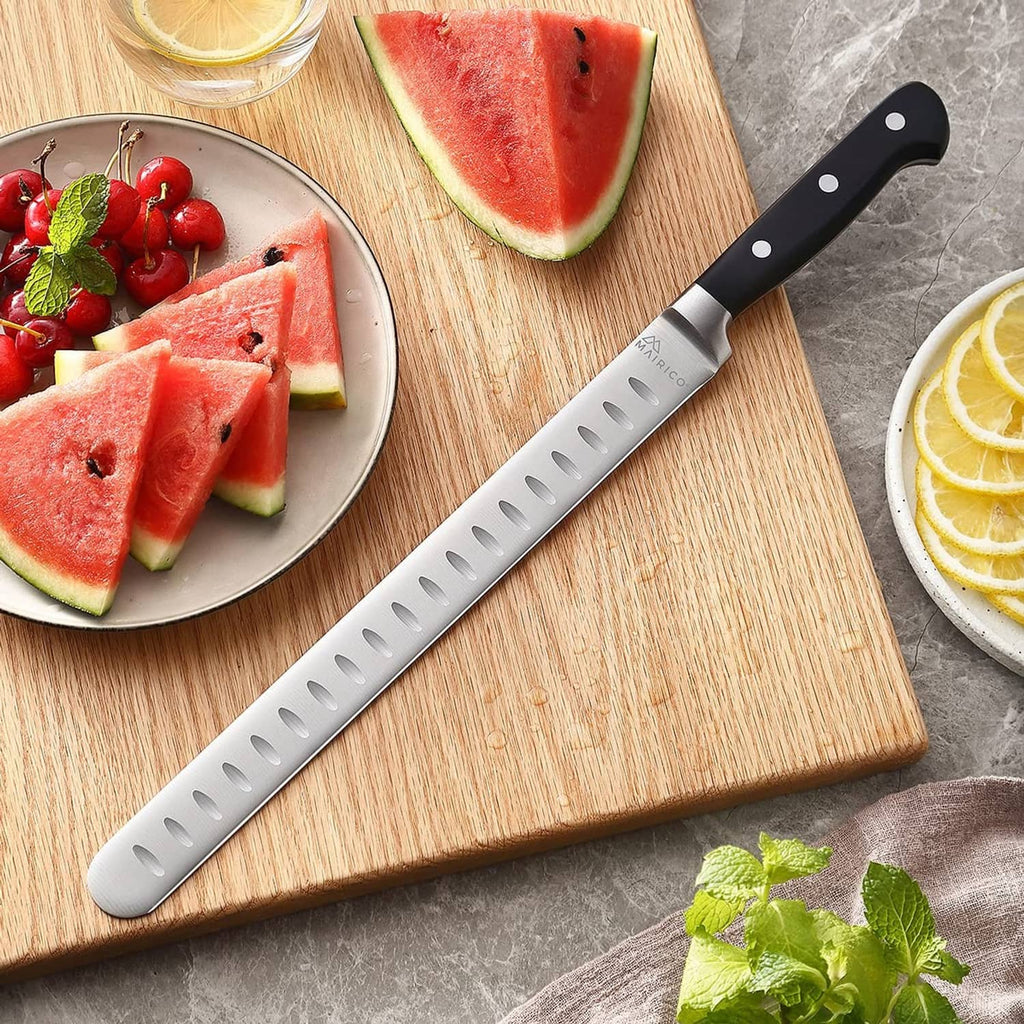Mairico brisket slicing knife on cutting board near watermelon slices and fruit