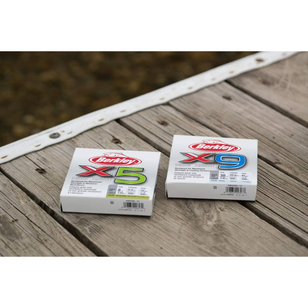 Berkley X5 and X9 braided fishing line boxes on wooden dock
