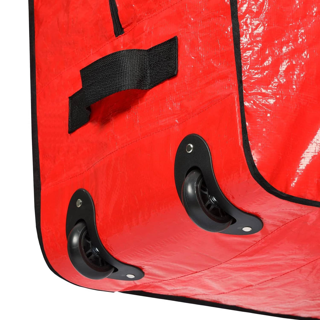 Red tree storage bag corner with black wheel pulls and stitched reinforcement straps