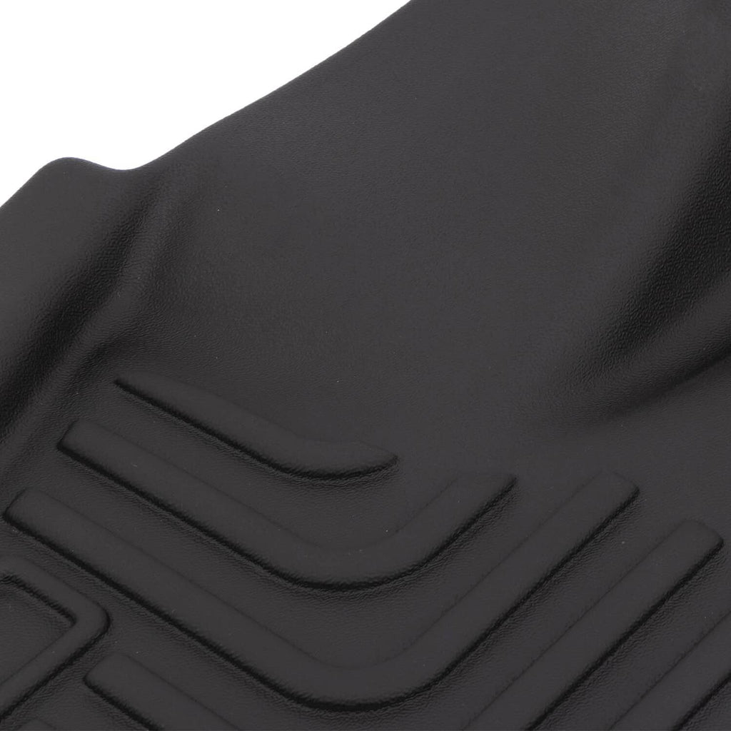 Black rubber floor mat liner detail with raised channels and textured grip surface