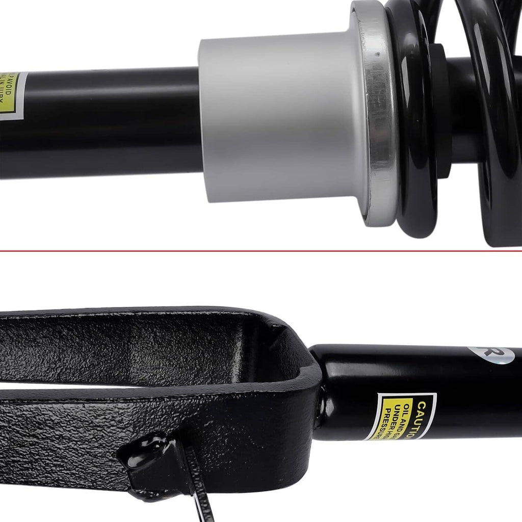 Close-up of shock absorber cylinder with black rod and silver mounting collar