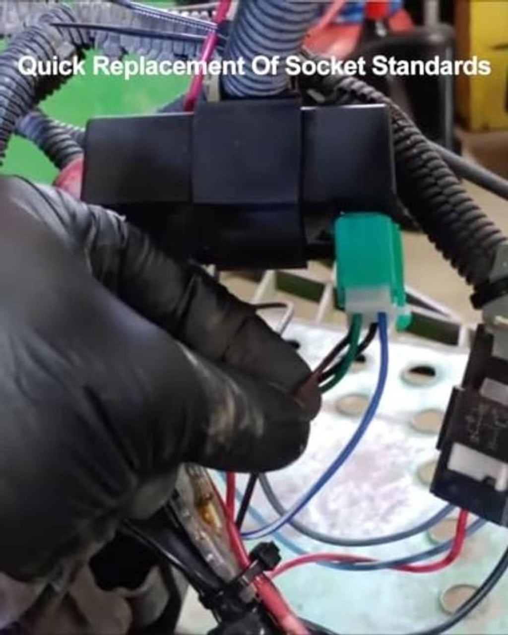 Black CDI ignition module connected to a wiring harness with colored leads