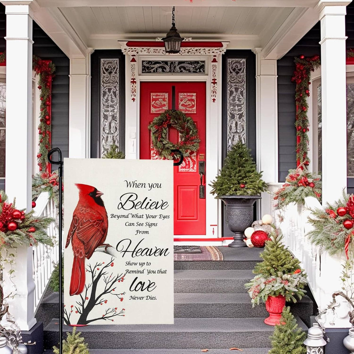 Winter porch garden flag featuring a red cardinal and “Believe” devotional wording