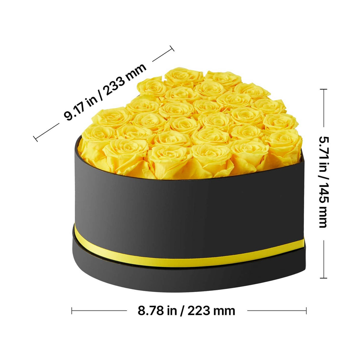 Close-up of black heart-shaped box with yellow preserved roses and gold trim band