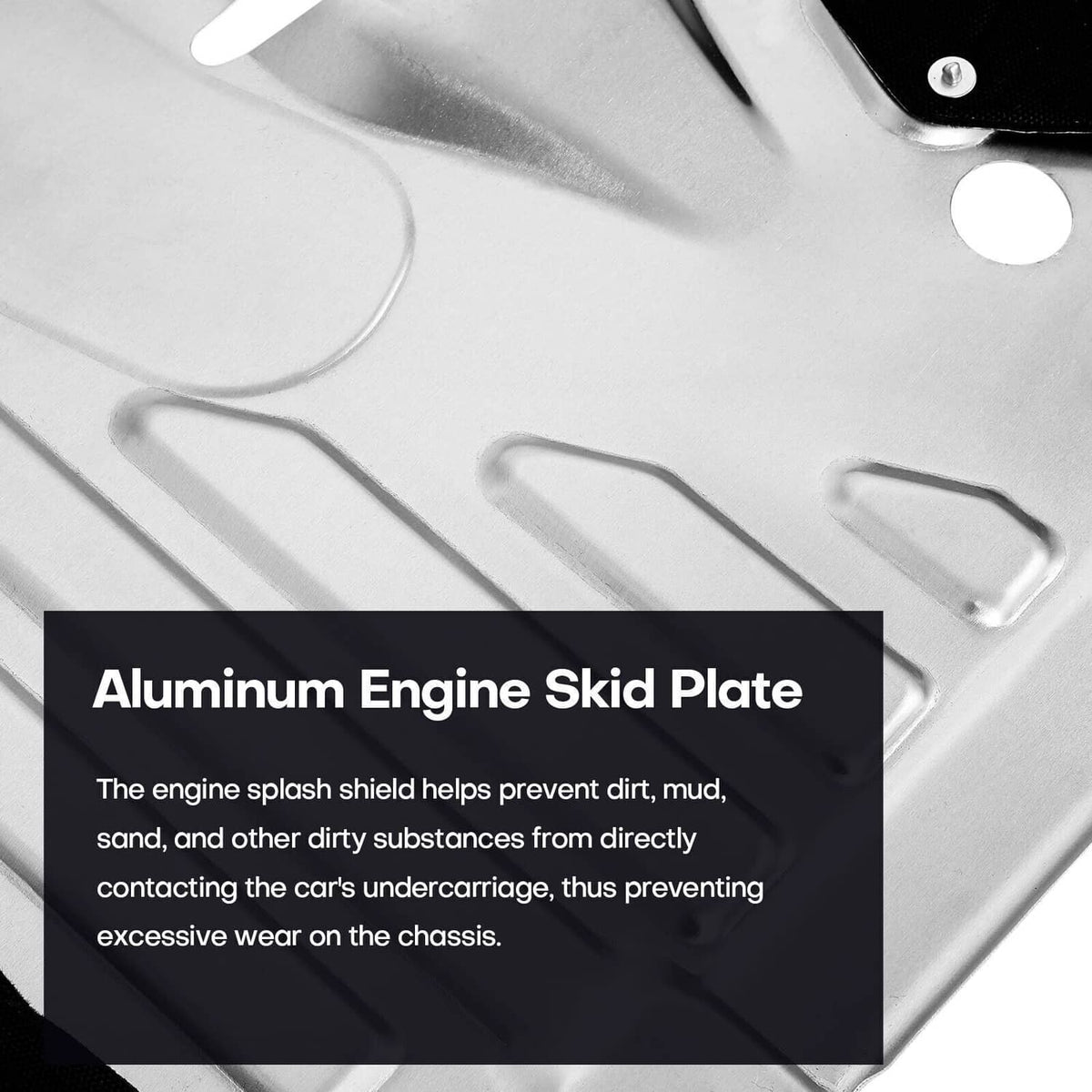 Close-up of silver aluminum engine skid plate with raised channels and mounting holes