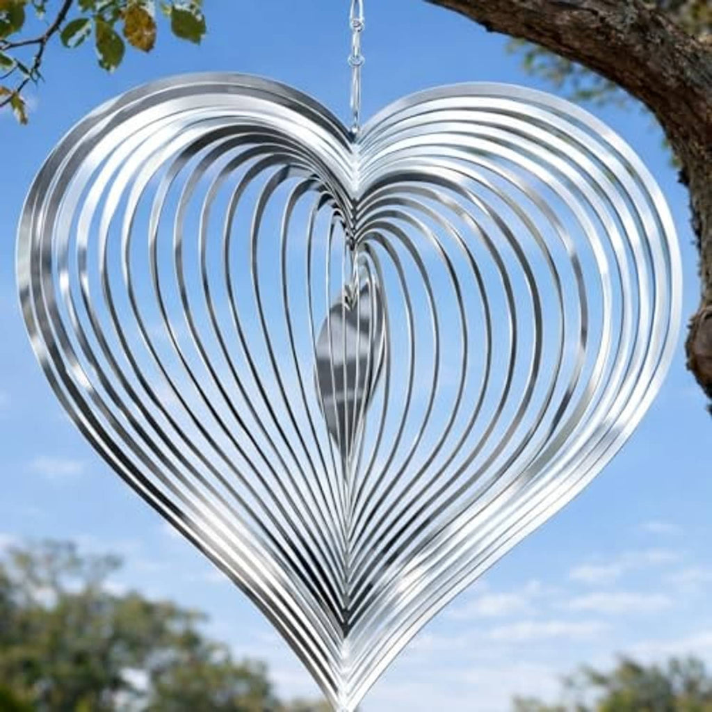 Silver heart wind spinner with concentric metal grooves and top hanging hook