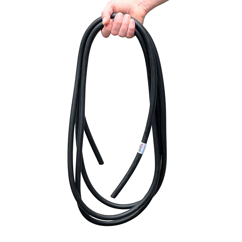 Black coiled resistance training band loop held in hand