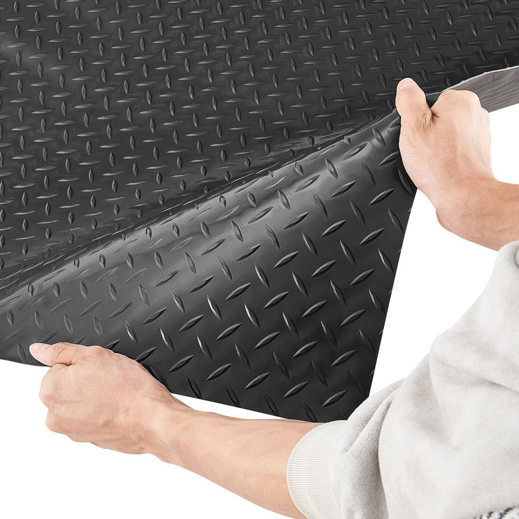 Dark gray PVC garage floor mat with raised diamond tread, non-slip surface edge shown