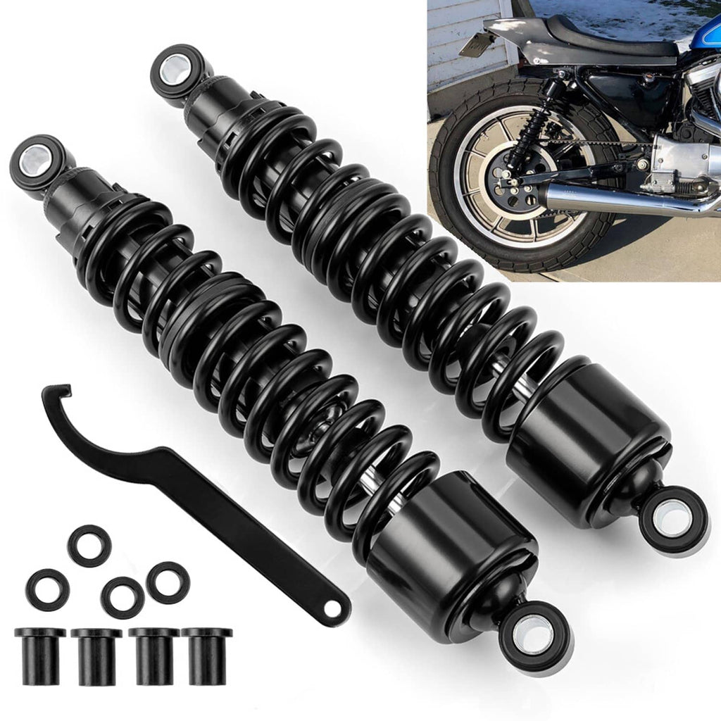 Pair of black rear shock absorbers with mounting hardware and wrench tool