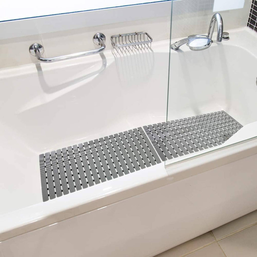 Grey ribbed shower mat placed in bathtub for slip-resistant footing