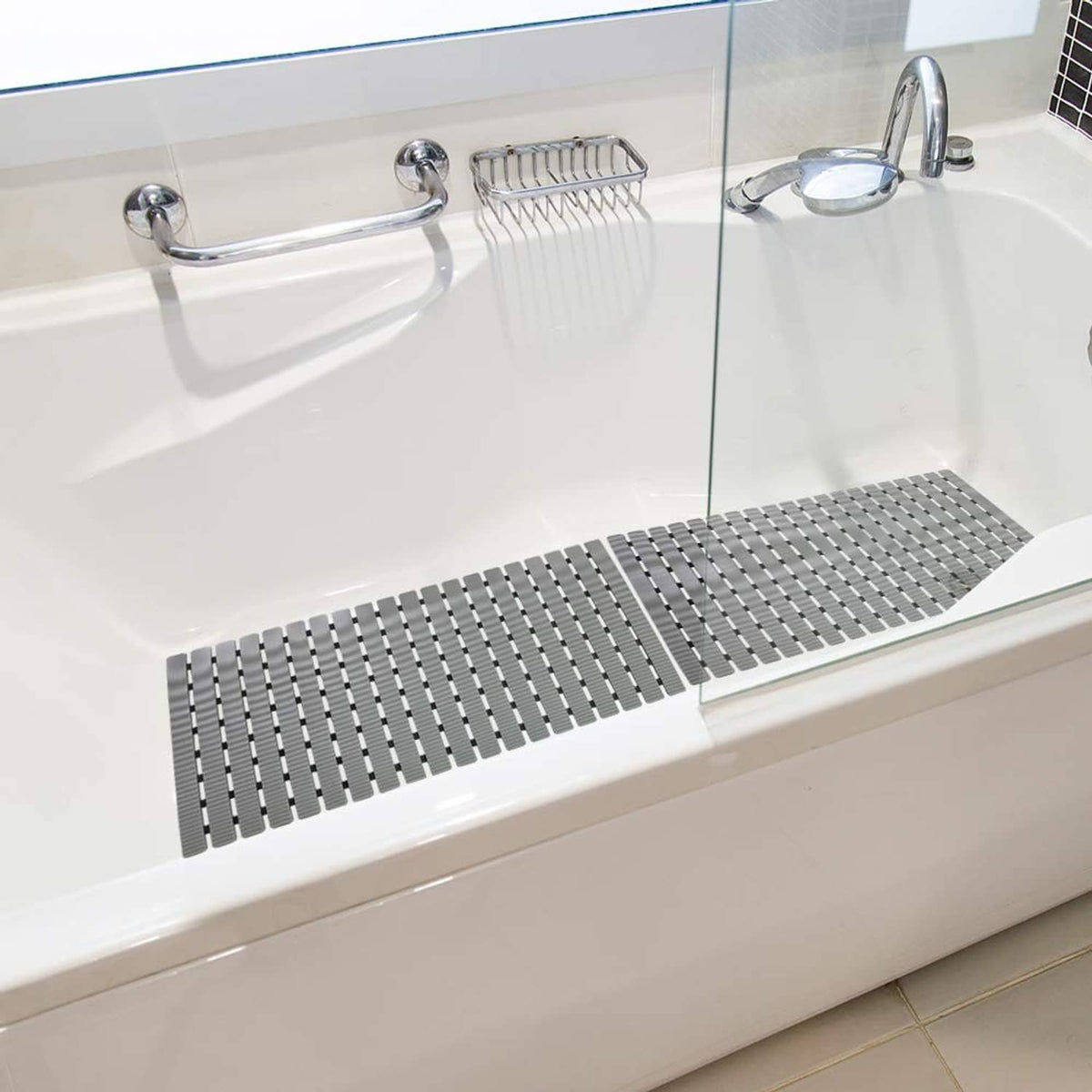 Grey ribbed shower mat placed in bathtub for slip-resistant footing