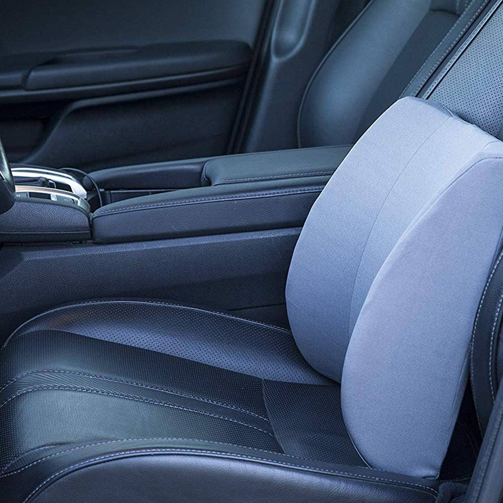 Light gray car seat lumbar support pillow placed against the back with blue seat belt