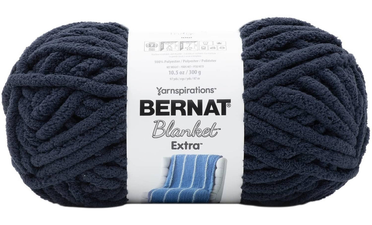 Bernat Blanket Extra jumbo chenille yarn skein, dark indigo blue, bundled package
