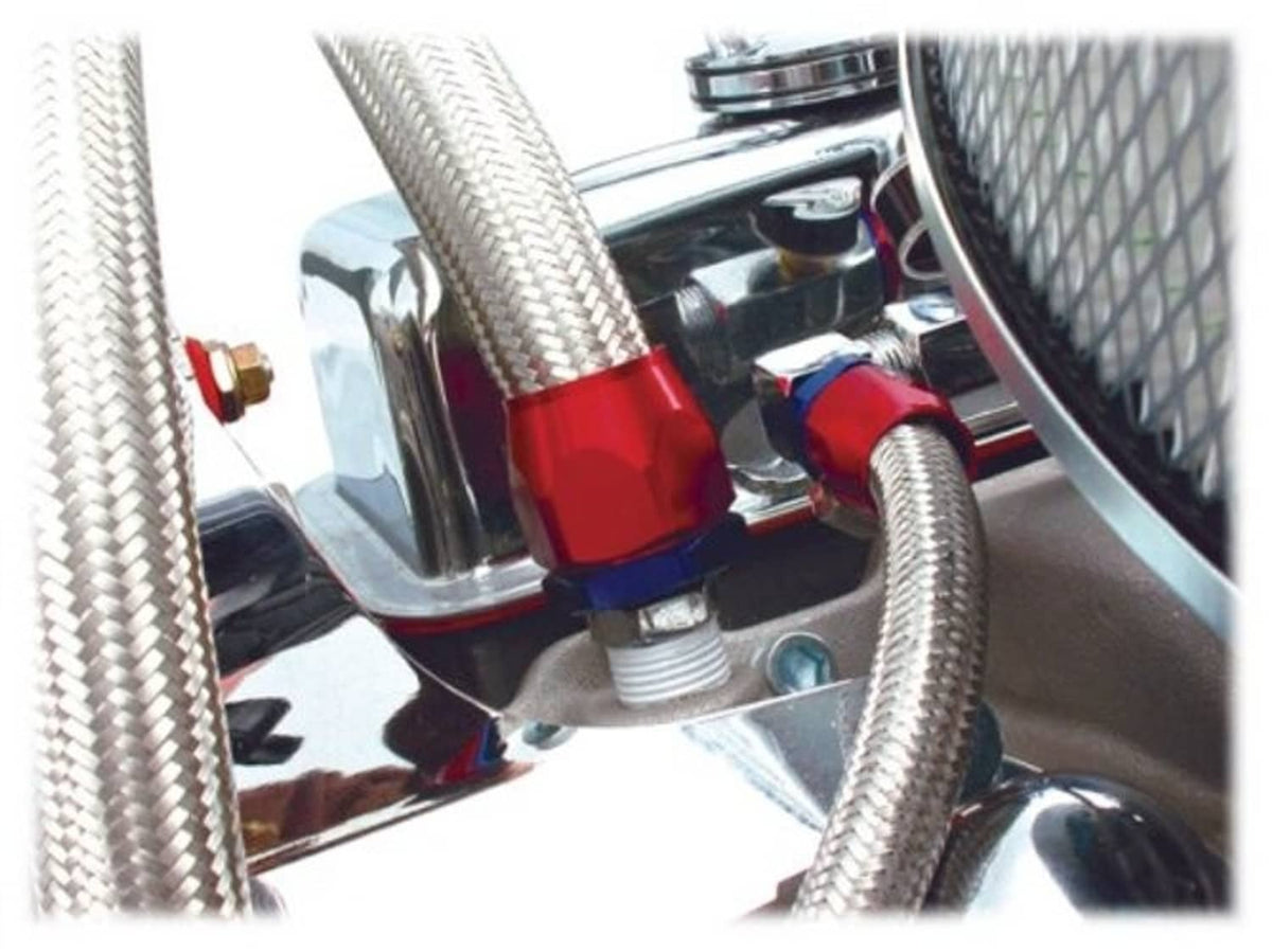 Heater hose fitting with threaded metal coupler attached to braided hoses in engine bay