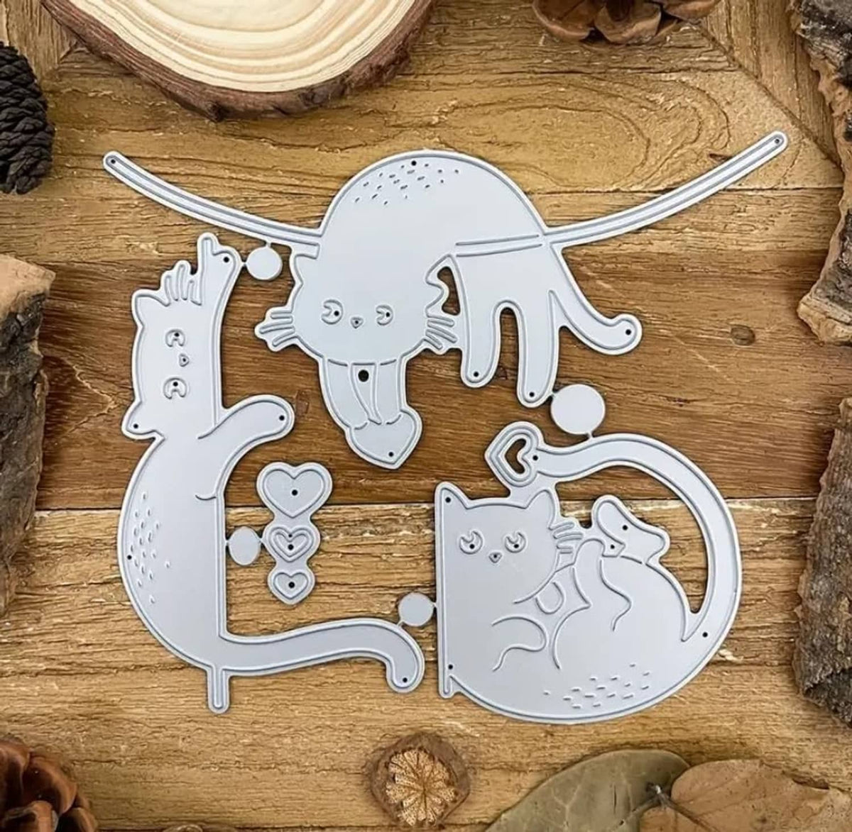 Silver cat metal die cuts featuring a tall cat, hearts, and a curled cat