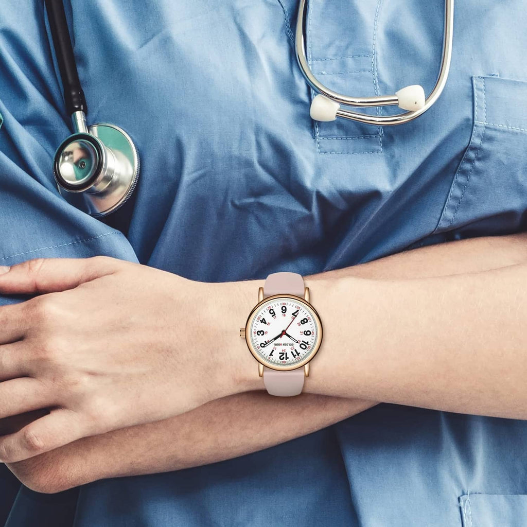 Rose gold nurse watch on wrist with white dial and blush silicone strap