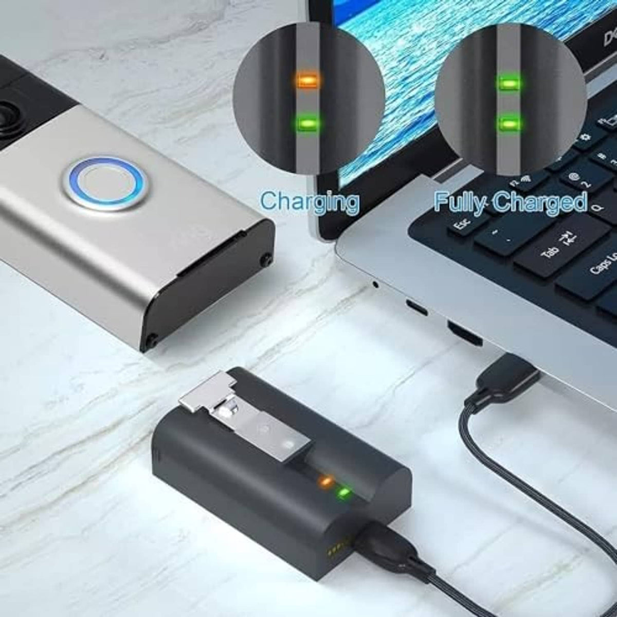 Two battery packs charging on a dual dock with LED indicators and USB cables