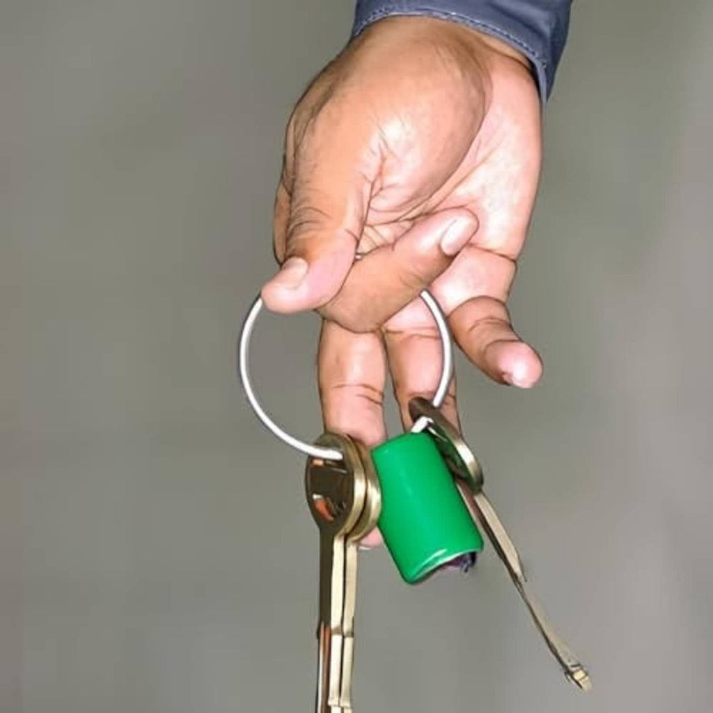 Split key ring securing keys, polished silver metal
