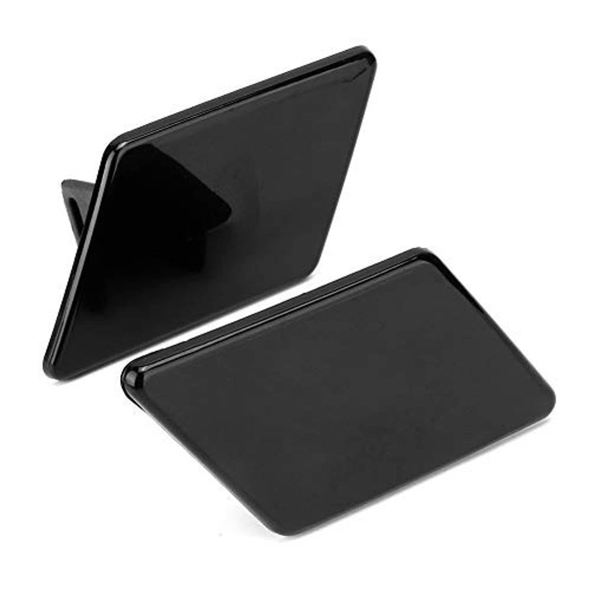 Headlight washer nozzle replacement cover pair, black exterior covers in angled view