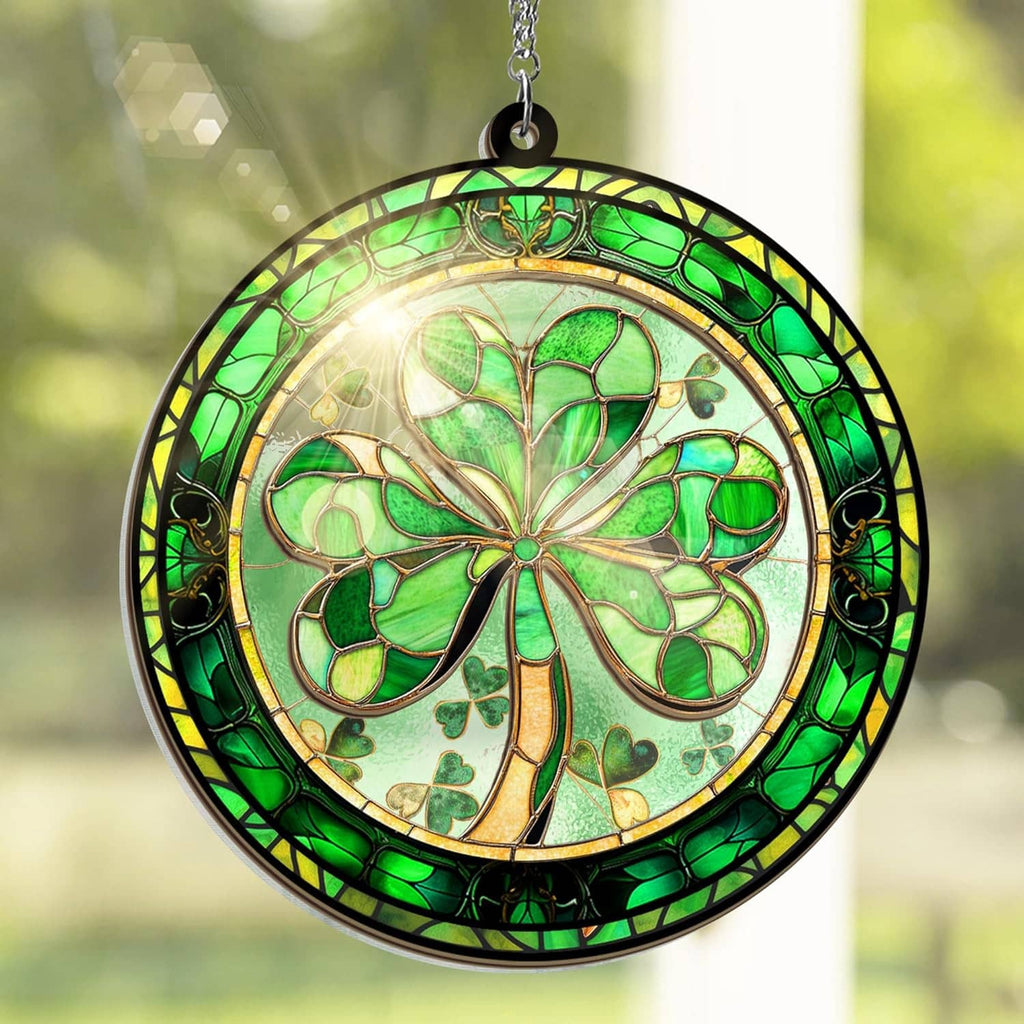 Close-up round hanging suncatcher with green shamrock stained-glass pattern and silver chain