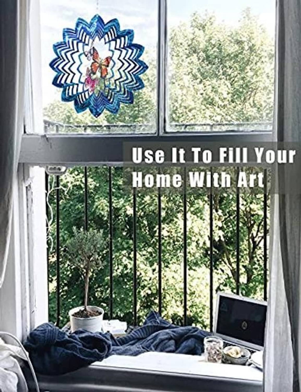 Blue butterfly wind spinner hanging near window with small matching flower charm