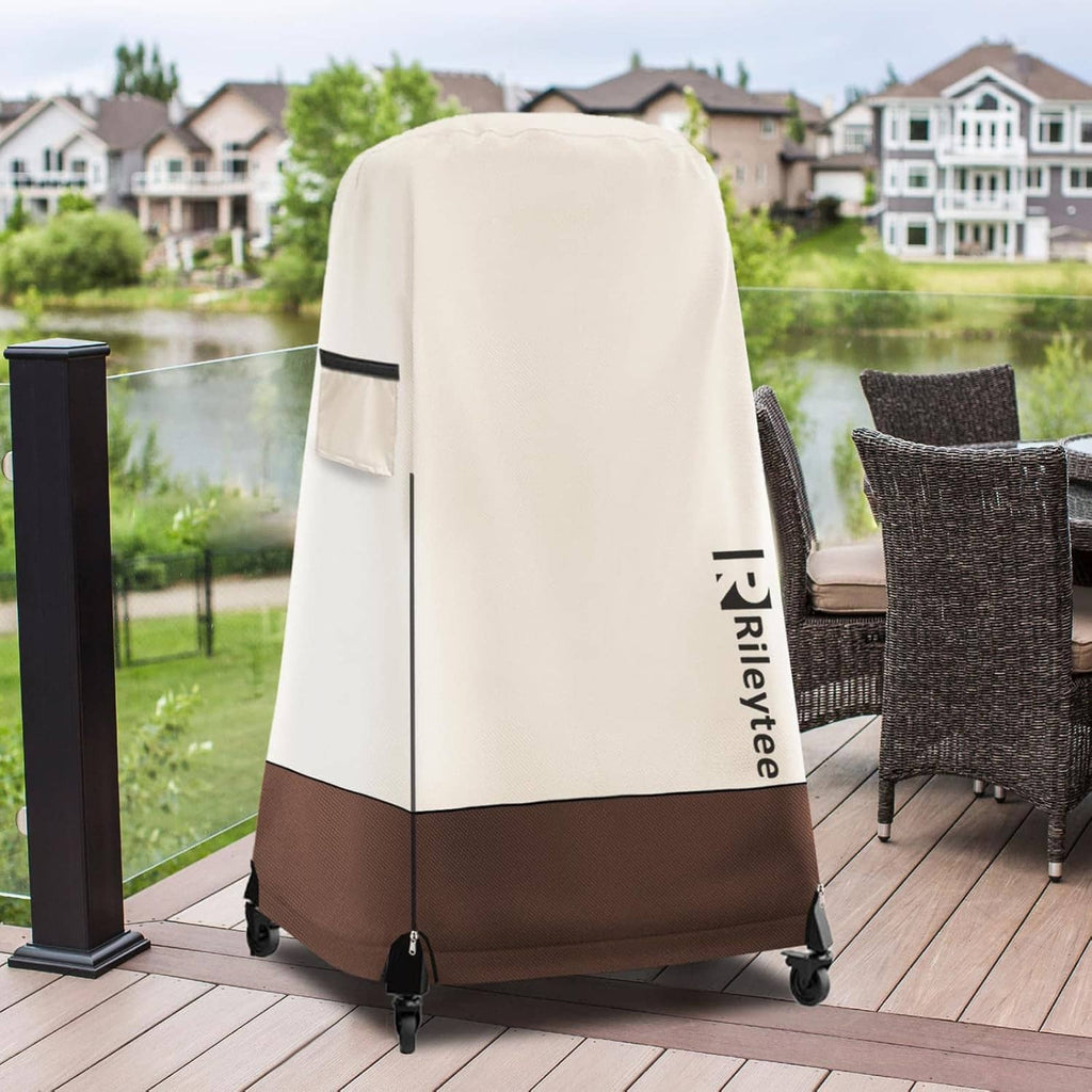 Cream and dark-brown pizza oven cover on an outdoor deck, with black vent panel.