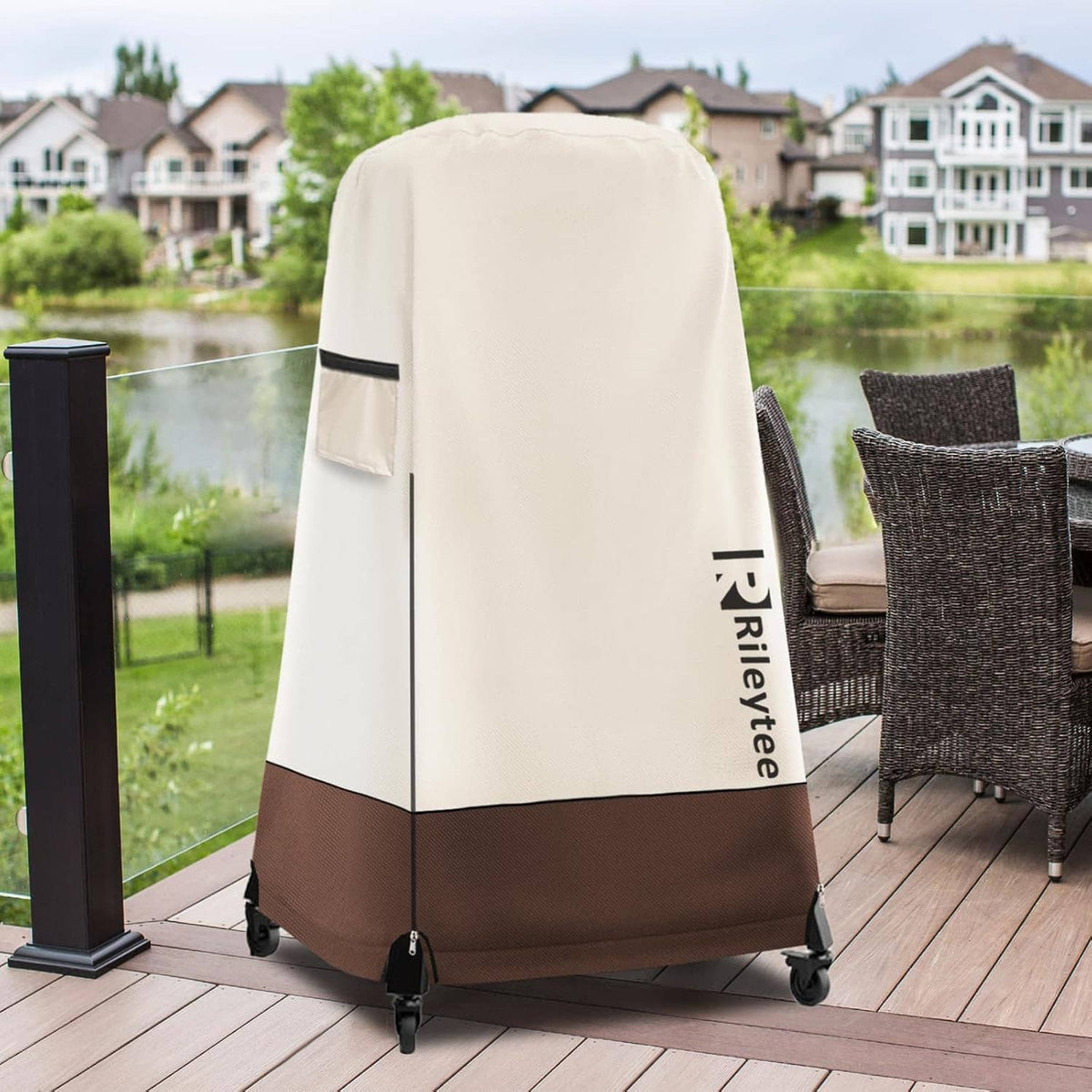 Cream and dark-brown pizza oven cover on an outdoor deck, with black vent panel.