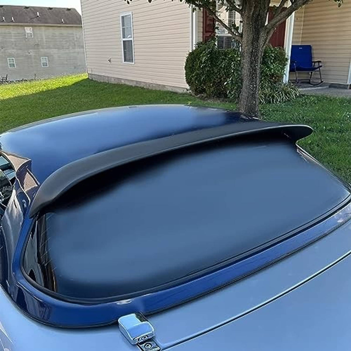 Matte black rear window roof spoiler installed on a blue hardtop rear roof