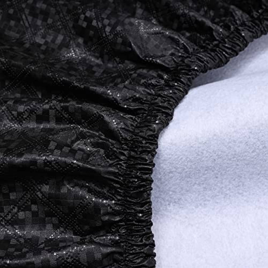 Close-up of black RV wheel tire cover fabric with gathered elastic edge detail