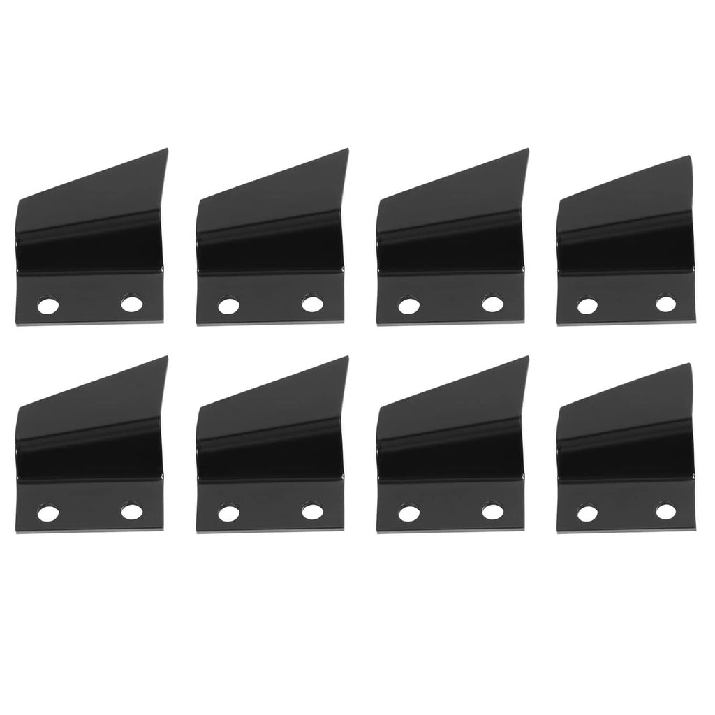 Group of black steel trencher teeth, each with two mounting holes