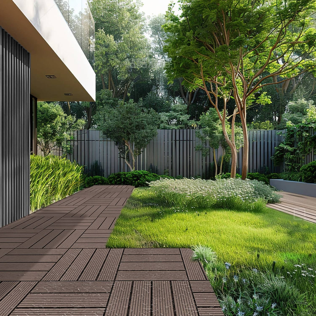 Dark brown interlocking deck tile patio section in a backyard setting