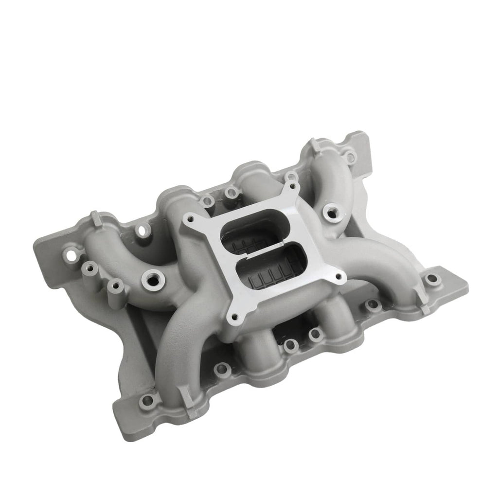 Grey engine intake manifold with dual black openings and surrounding mounting hardware
